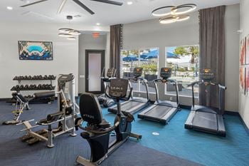 24-Hour fitness center with cardio and weight training equipment